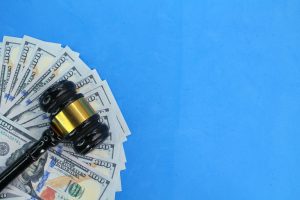 lawyer's hammer on paper money. concept of financial law.